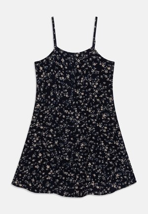 Robe sans manches bleu marine à fines bretelles, ornée d'un petit motif floral blanc et bleu clair, avec une jupe évasée.