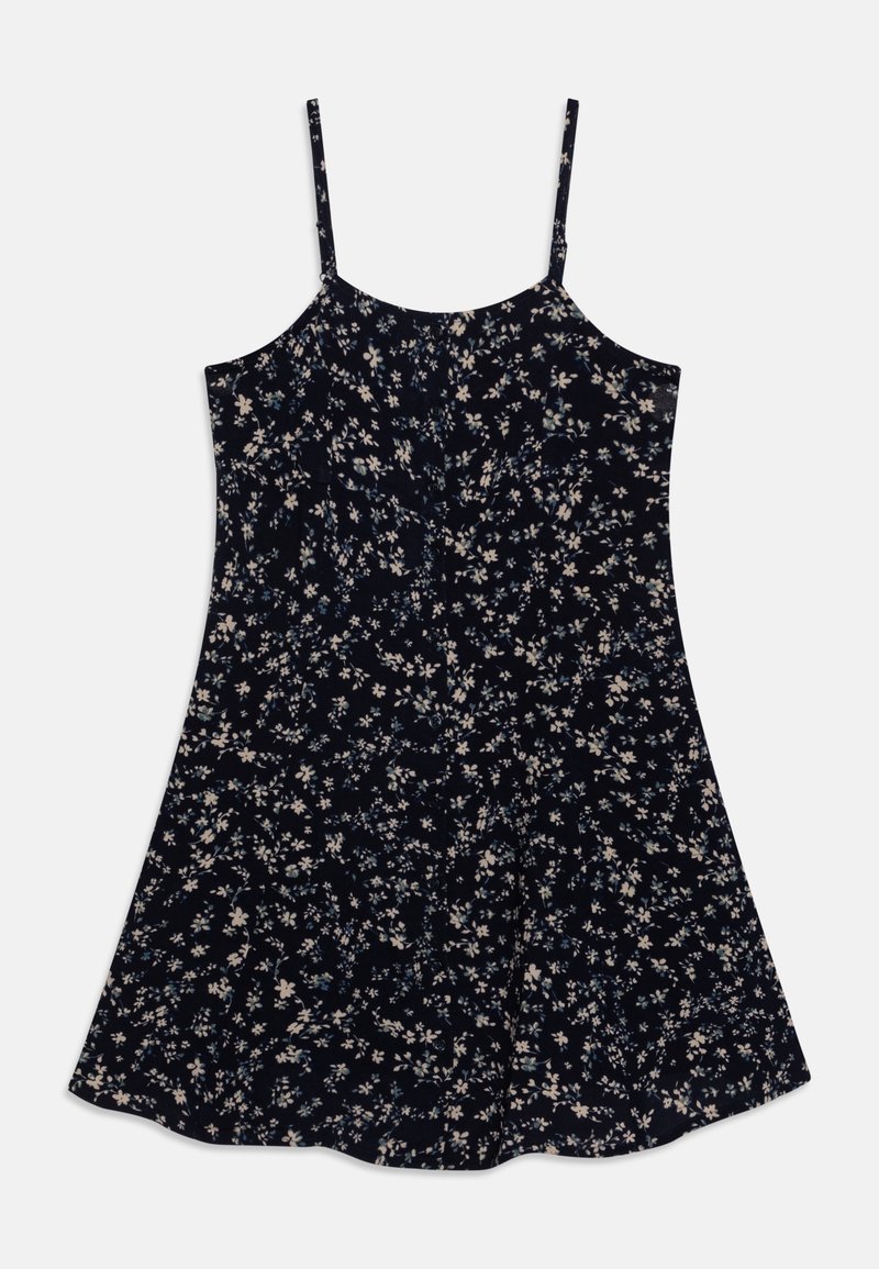 Robe sans manches bleu marine à fines bretelles, ornée d'un petit motif floral blanc et bleu clair, avec une jupe évasée.