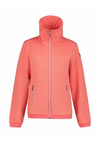 Gequilted koraalkleurige jacket met hoge kraag, voorzien van een driehoekig patroon, ritssluitingen en contrasterende ritsdetails.