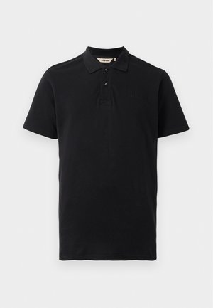 Zwarte polo shirt van textuur katoen. Heeft een twee-knopen sluiting, korte mouwen en een subtiele geborduurde logo op de borst.