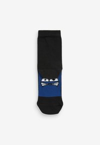 Svarta strumpor med en blå randig design som har en ninjakaraktärs ansikte, inklusive stora ögon och vita detaljer.