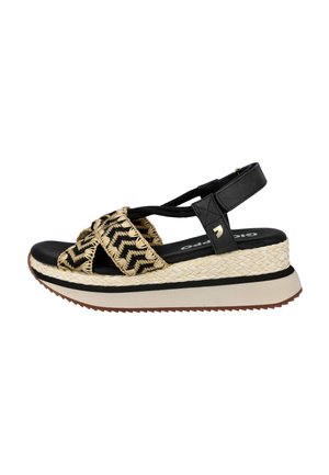 Sandalia cuña negra y beige con tiras tejidas en zigzag, tira negra en el tobillo, suela acolchada y tacón plataforma texturizado.