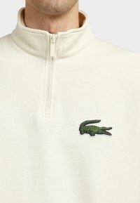 Lacoste HALFZIP HIGH UNISEX - Ikdienas džemperis - beige
