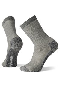 Grå sokker med ribbet design, med mørkere hæl- og tådetaljer. Materialet virker slitesterkt med en teksturert overflate.