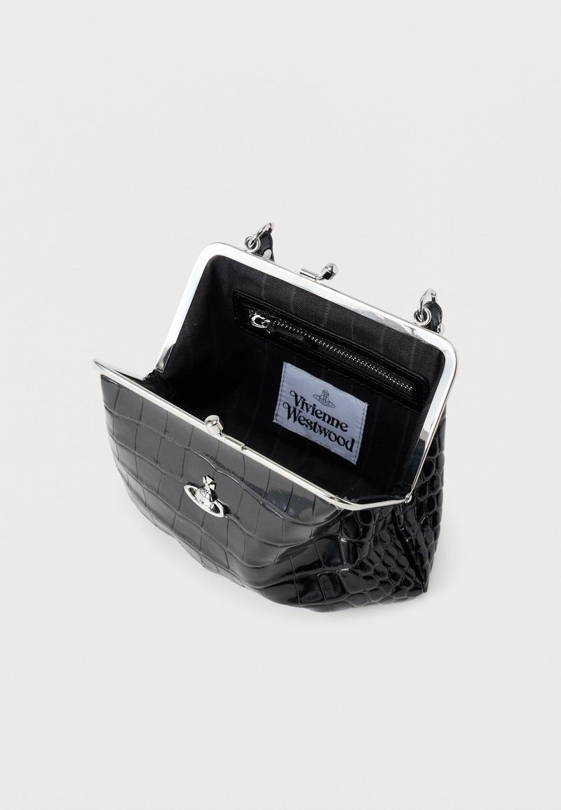 Black crocodile-embossed handbag with a silver clasp. Interior features a zip pocket and a label with "Vivienne Westwood" logo.