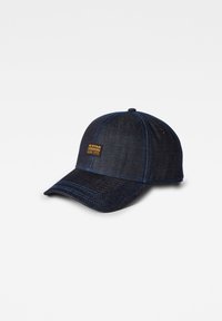 Mørk denim baseballcap med blå sømmer og et G-Star Originals merke. Har et buet skygge og justerbar bak.