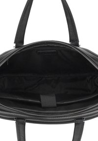Black leather handbag with a textured exterior, zip closure, dual handles, and a spacious interior lined in black fabric.