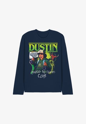 Navy long-sleeve shirt with "Dustin" text, character holding gadgets, "Stranger Things" and "Hawkins Investigators Club" graphics.