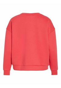 Koralowa bluza z dresu o luźnym kroju, opuszczonymi ramionami, ściągaczami na mankietach i u dołu. Gładka tekstura z prostym i czystym wzorem z tyłu.