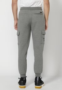 Koroshi LARGO - Donji dijelovi trenirke - gris medio vigoré   dark grey vigore