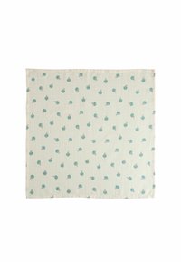 Bomulldukar med en ljus gräddbakgrund, som har små, teal snäckmönster med bruna accenter och strukturerade vertikala ränder.