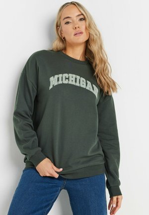 Green sweatshirt with "MICHIGAN" printed in a lighter shade. Long sleeves and ribbed cuffs, made from a soft, textured fabric.