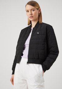 Calvin Klein Jeans QUILTED - Overgangsjakke - black