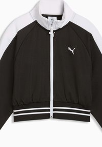 Veste de sport zippée noire et blanche avec col montant, taille élastique et logo brodé sur le côté gauche de la poitrine.