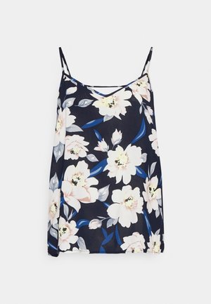 Marineblauwe mouwloze camisole met dunne bandjes, versierd met grote witte en lichtroze bloemenpatronen en blauwgrijze bladeren.