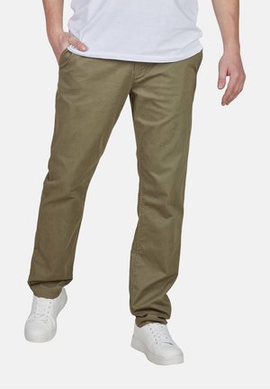 Khaki cotton pants with a straight-leg fit, featuring side pockets, worn with white sneakers. Smooth texture, casual design.