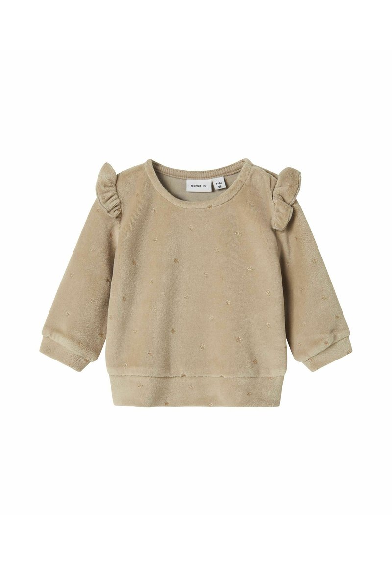 Beige fleecetrui met gerimpelde schouderaccenten, getextureerde stippen en elastische manchetten. Heeft een ronde halslijn en een geribbelde zoom.