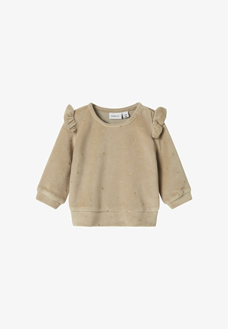 Beige fleece sweatshirt with ruffled shoulder accents, textured dots, and elastic cuffs. Features a crew neckline and ribbed hem.
