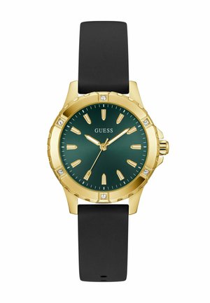 Gold-tone watch with a green dial, luminescent markers, and a black silicone strap. Features four crystal accents on the bezel.