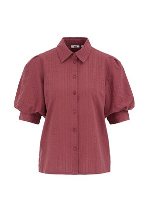 Īss piedurkņu blūze ar pogām, darināta no teksturētas putekļainas rozā auduma, ar uzpampušām piedurknēm un klasisku apkakli.