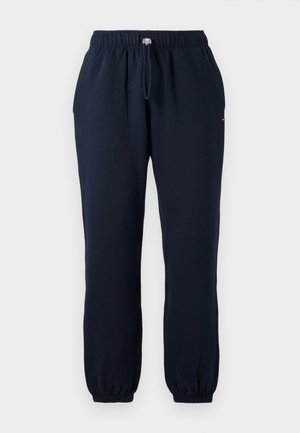 Marineblauwe joggers met een elastische tailleband, verstelbare trekkoord, zijzakken en elastische boorden. Zachte stof met een gladde textuur.