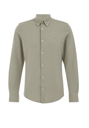 Long-sleeve shirt in light olive green, button-up front, pointed collar, and subtle logo on chest. Soft fabric, smooth texture.