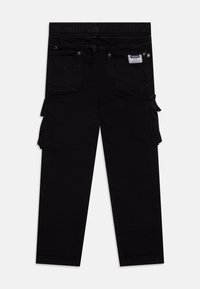 Black cargo pants with an elastic waistband, multiple pockets, and a tapered design, featuring a smooth denim texture and plain stitching.