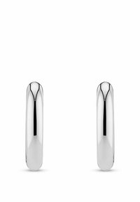 Orecchini a cerchio in argento lucido con un design morbido e arrotondato. Presentano una chiusura senza giunzioni e una superficie uniforme e lucida.