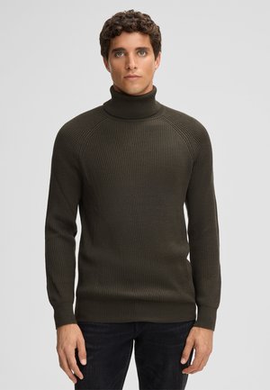 Olivgrüner Rollkragenpullover mit geripptem Stoff und langen Ärmeln, mit taillierter Passform und hohem Kragen. Trägt man über dunklen Jeans.