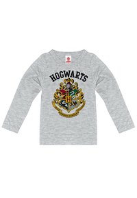 Gray long-sleeve t-shirt featuring the Hogwarts crest in black, red, yellow, green, and blue, with text "HOGWARTS" above the crest.