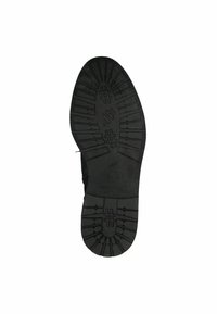 Black rubber shoe sole, featuring a textured grip pattern with raised sections and defined tread lines for traction and durability.