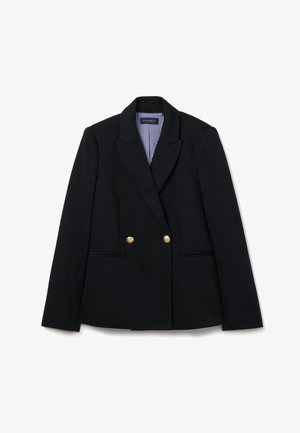Blazer noir à double boutonnage avec deux boutons dorés, poches latérales et doublure en tissu rayé. Coupe ajustée avec des épaules structurées.