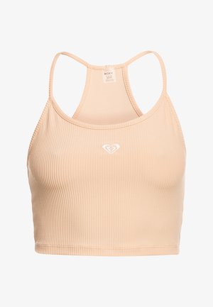 Ferskenfarget ribbet crop-top med racerback-design. Har et lite hvitt hjerte-logo på brystet og glatt elastisk stoff.