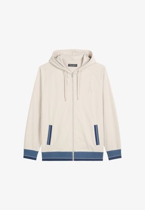 Lichtbeige zip-up hoodie met een capuchon, met marineblauwe accenten op de zakken en de zoom, en subtiele borduursels van het logo op de borst.