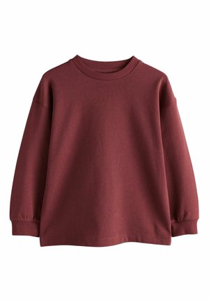 Bordó pamut pulóver kerek nyakkal, lejjebb eső vállakkal és bordás mandzsettákkal. Simaságot és laza illeszkedést kínál.