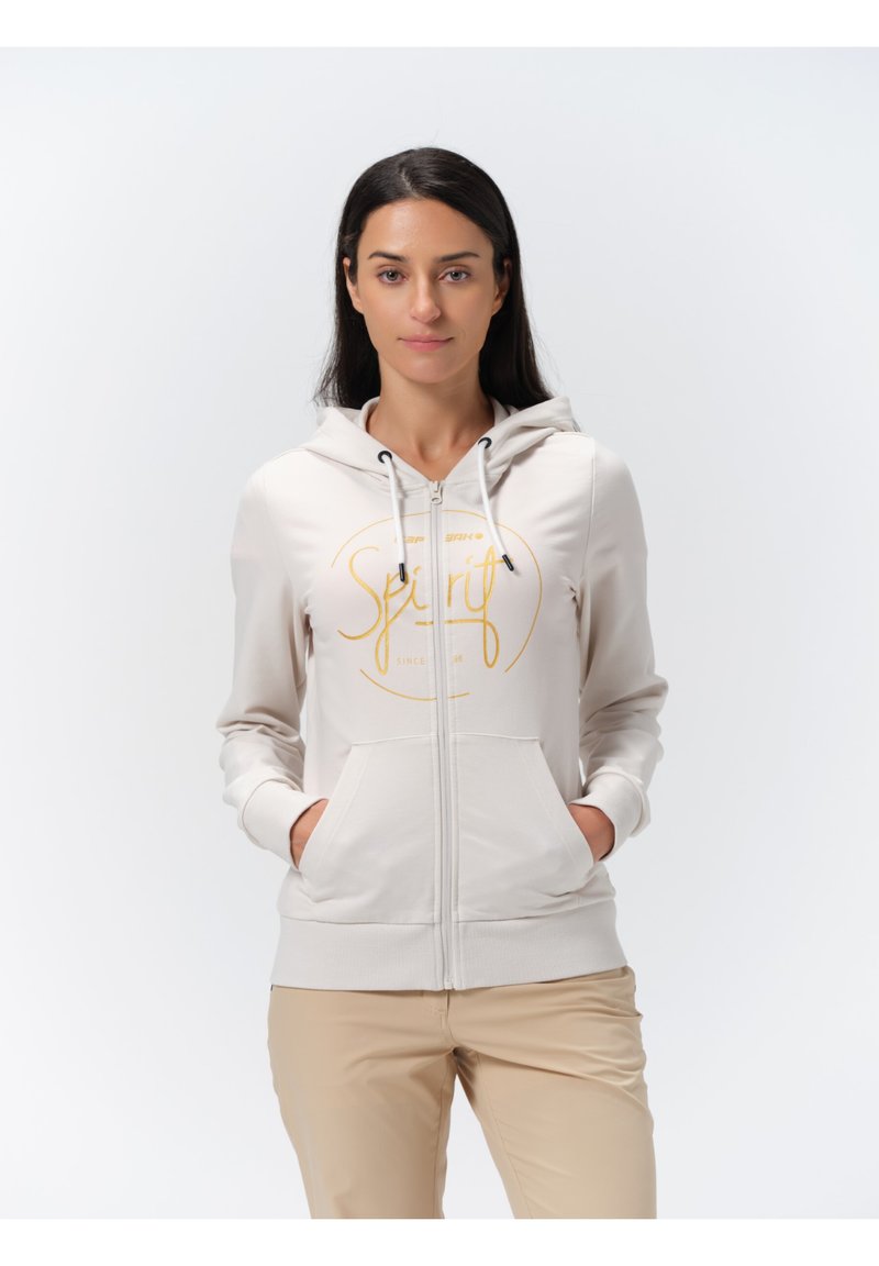 Lichtbeige rits hoodie met een voorlogo waarop "Spirit" in goud staat, voorzien van een koordkap, twee zijzakken en geribde manchetten.
