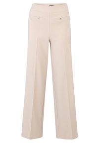 Pantalons larges beiges en tissu lisse. Dotés de poches avant avec des accents métalliques ronds, de lignes épurées et d'une taille haute.