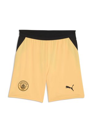 Gule sportsshorts med sort taljebånd, sorte sidepaneler, Manchester City-logo på venstre ben og Puma-logo på højre ben.
