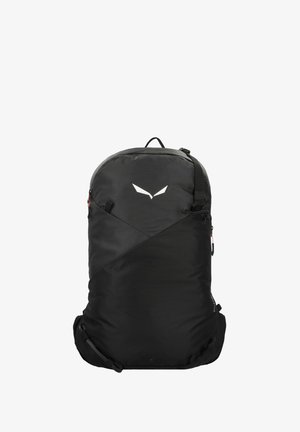 Zaino nero di forma rotonda, realizzato in tessuto resistente. Presenta un design geometrico, spallacci regolabili e un logo bianco distintivo.