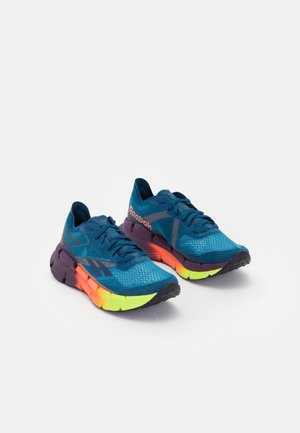 Lightweight running shoes featuring a blue mesh upper, multicolored midsole in purple, orange, and lime green, with textured rubber outsole.