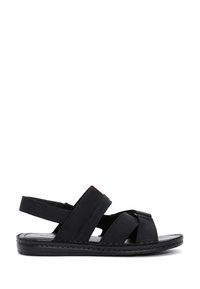 Sandalias de cuero negro con tiras cruzadas, diseño de punta abierta y suela acolchada. Ligeras, con un detalle de borde cosido.