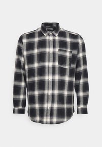 Schwarz-weiße kariertes Hemd aus Flanell mit einem Button-Down-Kragen, langen Ärmeln, einer Brusttasche und abgerundetem Saum.