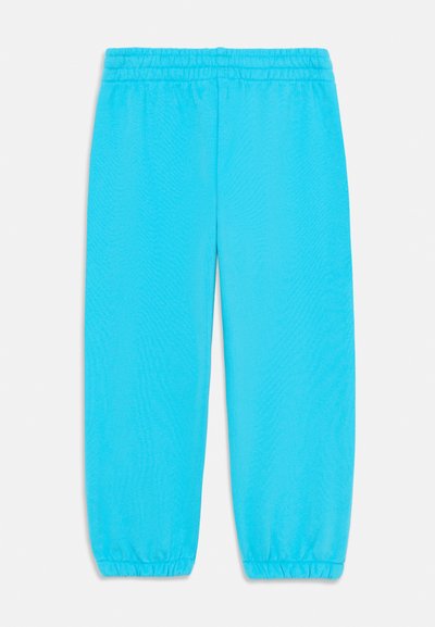Pantalones deportivos turquesa con cintura elástica y puños elásticos. Fabricados en un tejido suave con una textura lisa y un corte relajado.