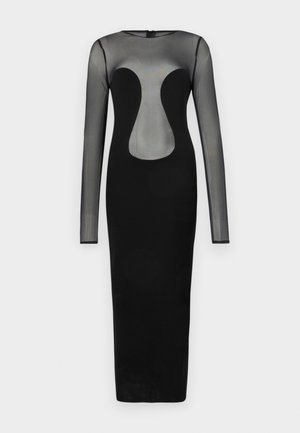 Svart langermet kjole med en gjennomsiktig overdel og geometrisk utskjæring. Skjørtet er kroppsnært og laget av solid svart stoff.