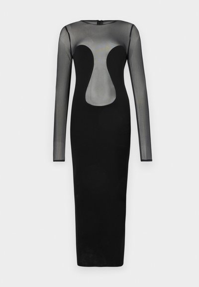 Musta pitkähihaista mekkoa, jossa on läpikuultava bodice ja geometrinen aukko-design. Helma on vartalonmyötäinen, valmistettu tukevasta mustasta kankaasta.