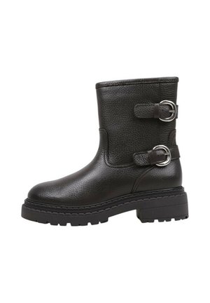 Bottines en cuir noir avec deux boucles en argent, surface texturée, bout rond et une semelle épaisse noire avec un motif de crampons.