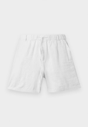 Pantalones cortos de lino blancos con cinturilla elástica y cordón de ajuste, con bolsillos laterales, exhibidos sobre un fondo liso.