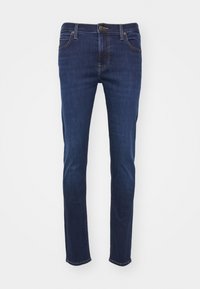 Jean en denim bleu foncé avec une coupe droite, doté de poches standard, d'une fermeture à bouton et d'accents de couture beige.