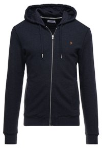 Sweat à capuche zippé bleu marine en tissu doux, avec capuche, poches avant et poignets côtelés. Petit logo sur la poitrine.