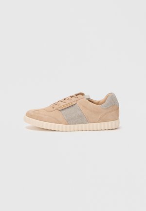 Beige suede sneakers with woven metallic accents and a textured cream rubber sole. Features lace-up design and cushioned sides.
